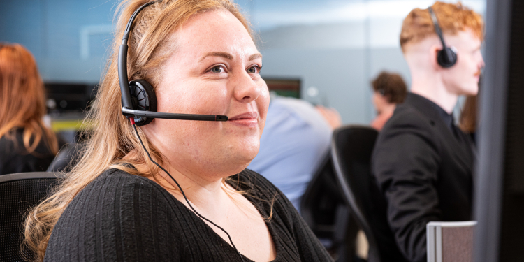 Customer Service member listening attentively to a customer call