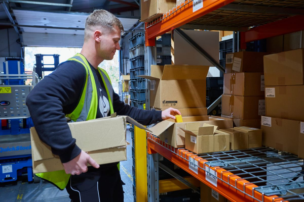 Dawleys warehouse worker picking stock for a customer's order