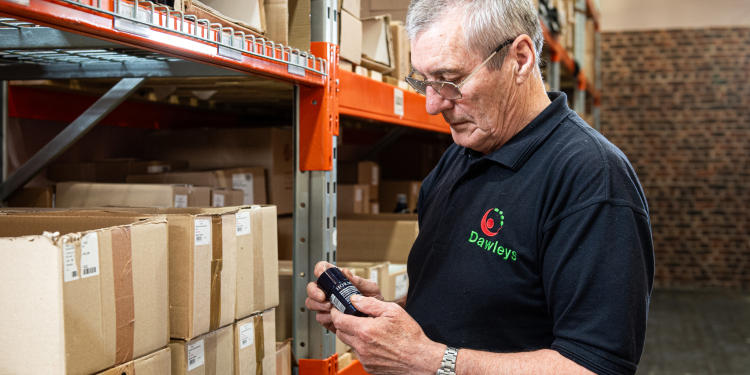 Warehouse worker inspecting stock for correct item