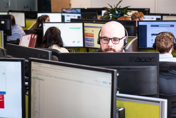 Call Centre agent helping a customer book an order request