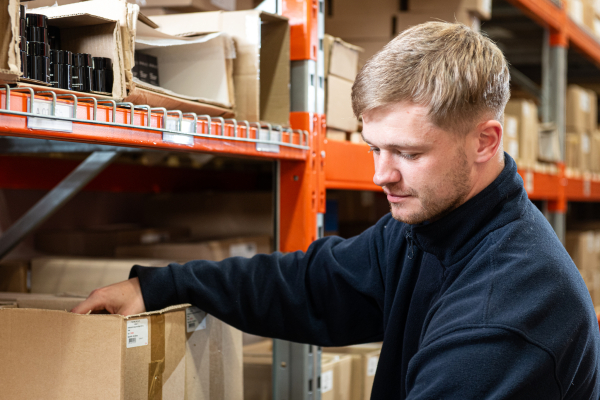 Warehouse fulfilment worker checking stock