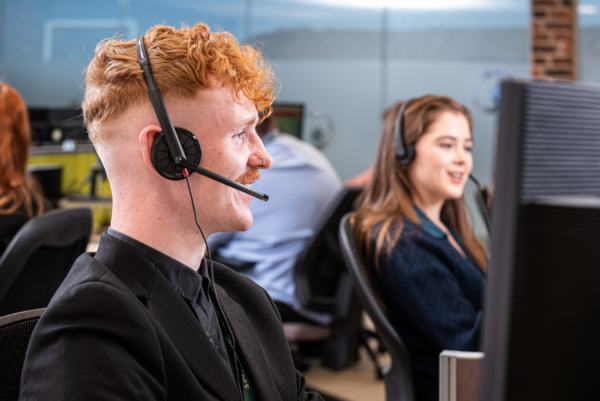 Contact Centre worker enjoying a conversation with a potential customer